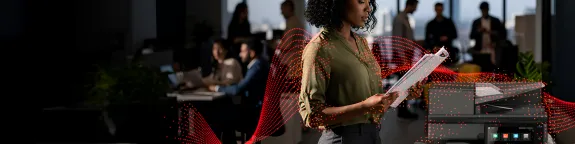 Woman using Sharp A3 MFP in an office space